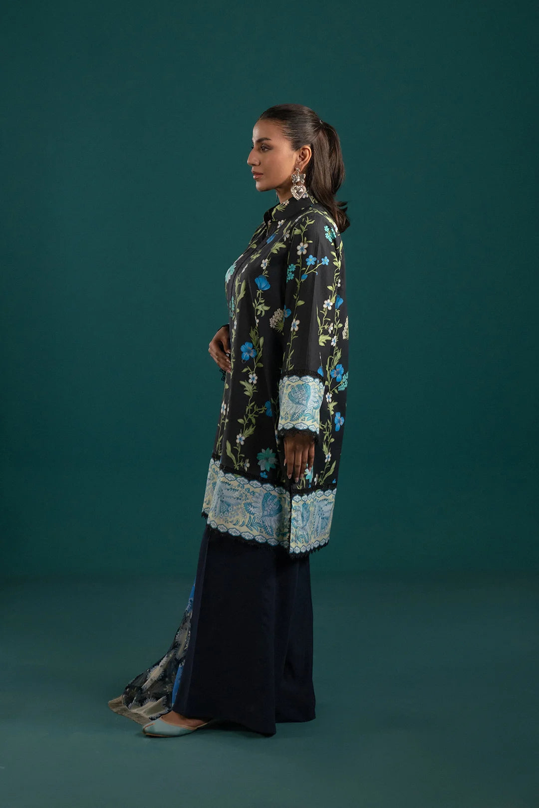 New lawn suit design in Pakistan – digital printed black lawn shirt with blue floral motifs, paired with a statement chiffon dupatta for a sophisticated touch.