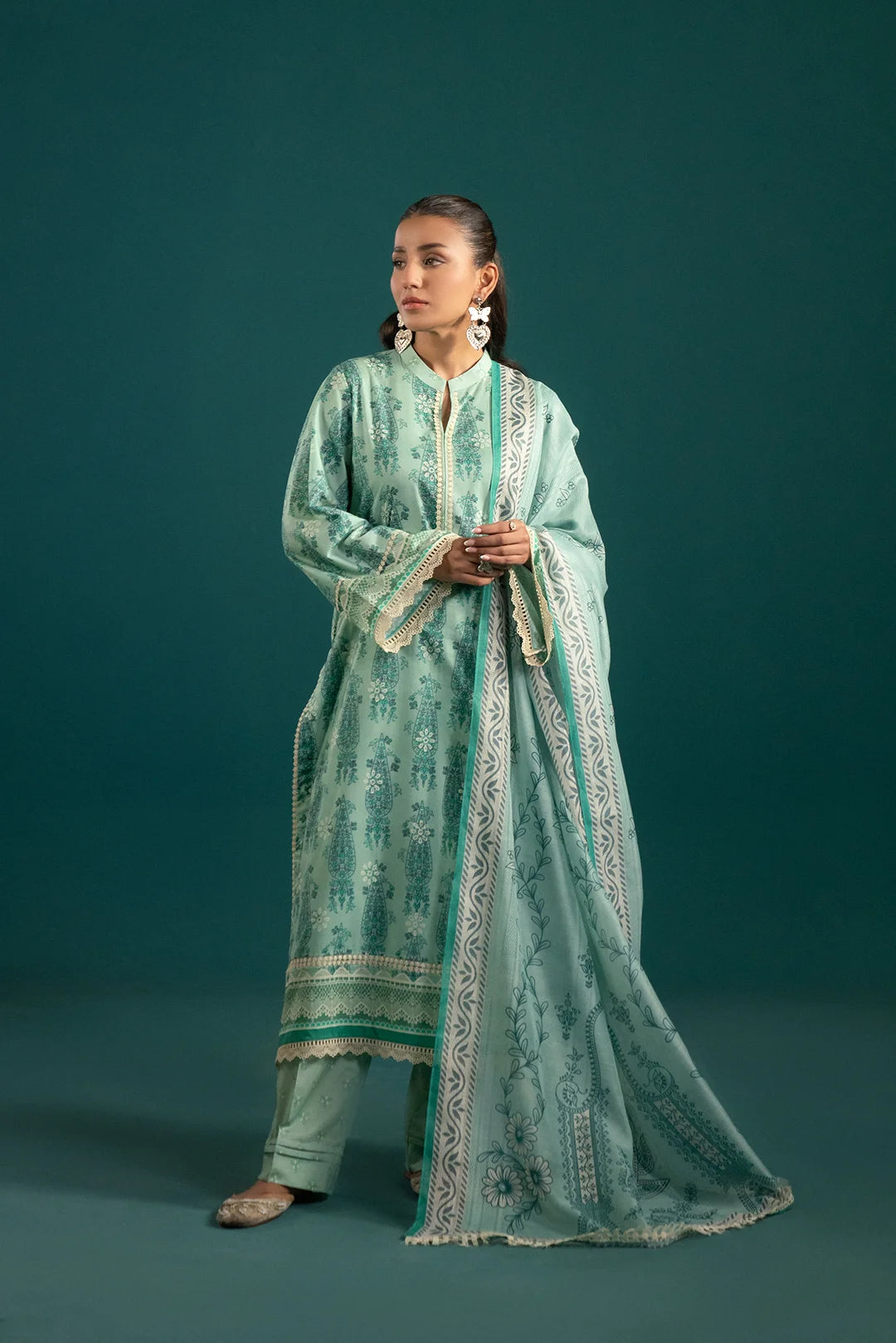 New lawn suit design in sea green with intricate digital prints, a paisley monark dupatta, and a composed border for a sophisticated look.