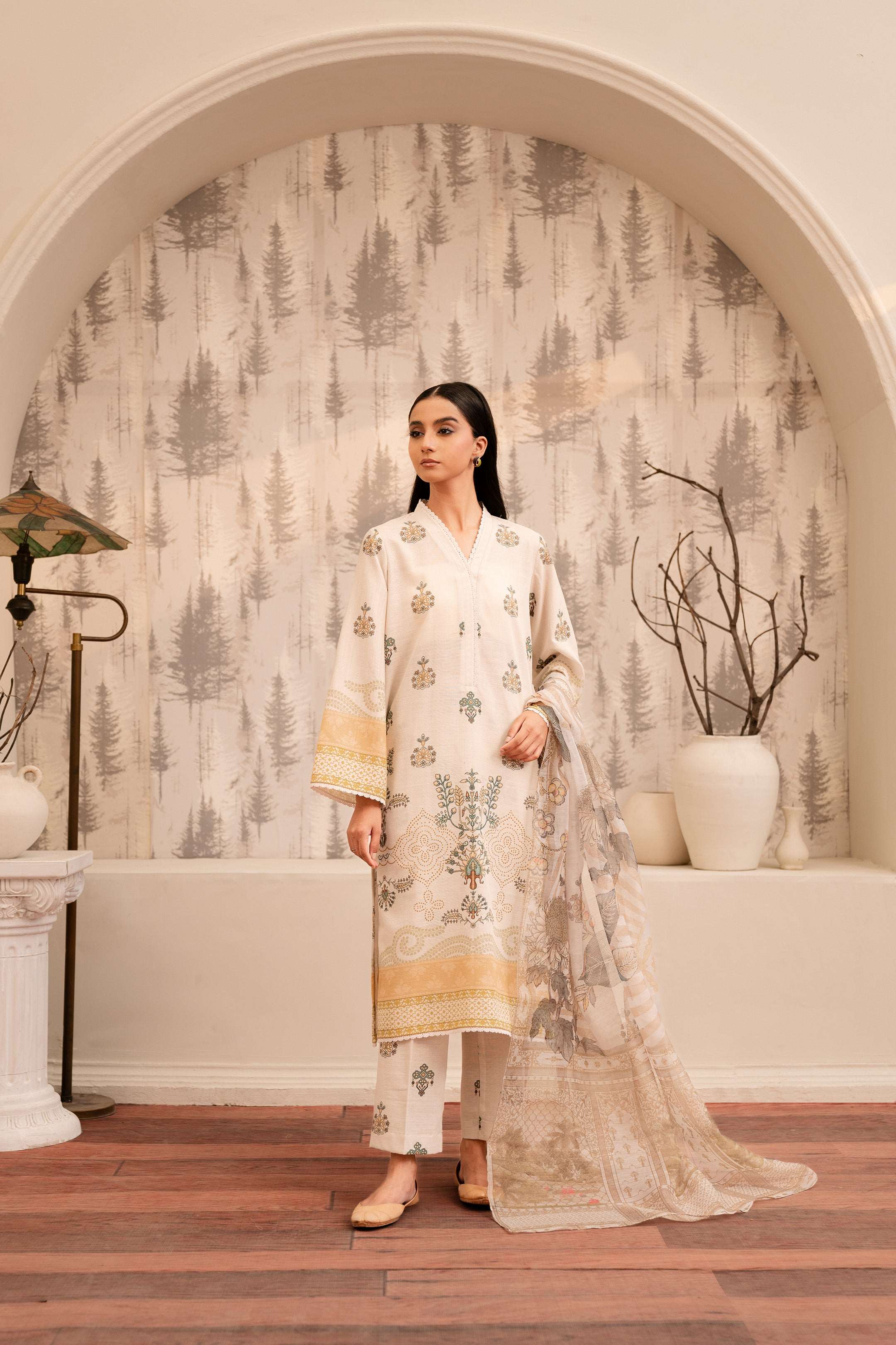 Off-white shirt with intricate embroidery and delicate lace trim