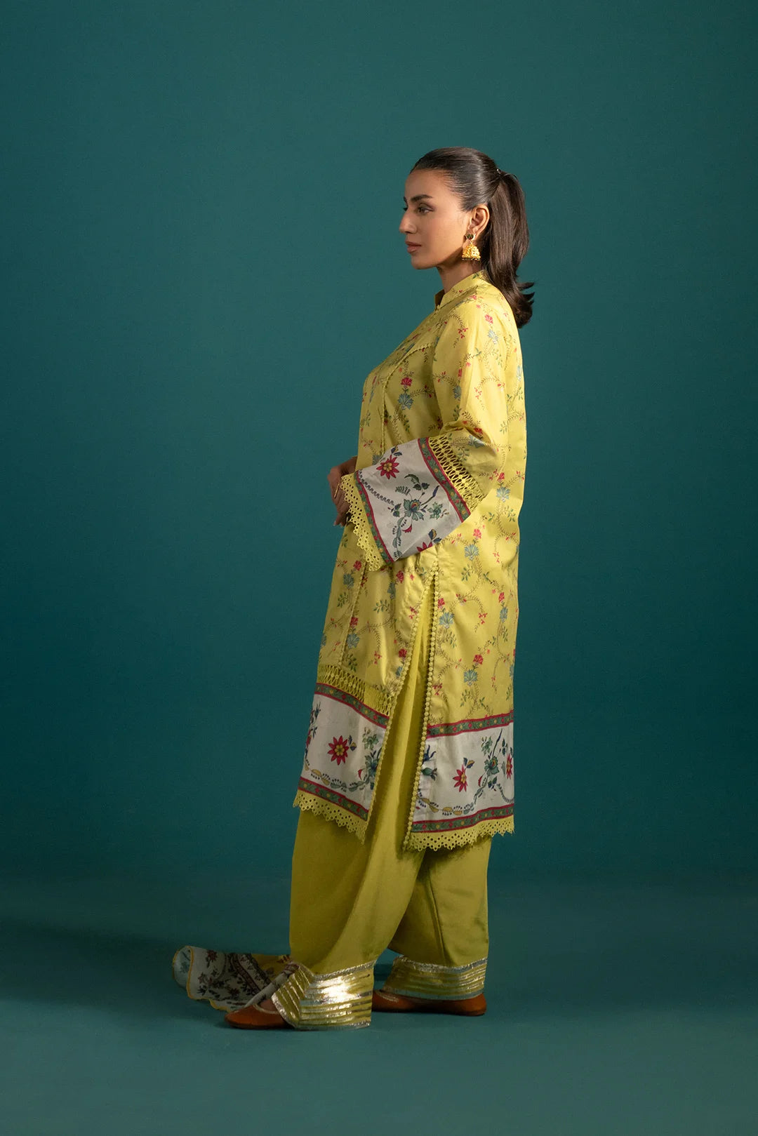Pakistani Lawn Suit Design - Trendy Summer Collection: A stylish and breathable three-piece lawn dress with intricate floral prints, a dyed trouser, and a printed monark dupatta, perfect for summer fashion.