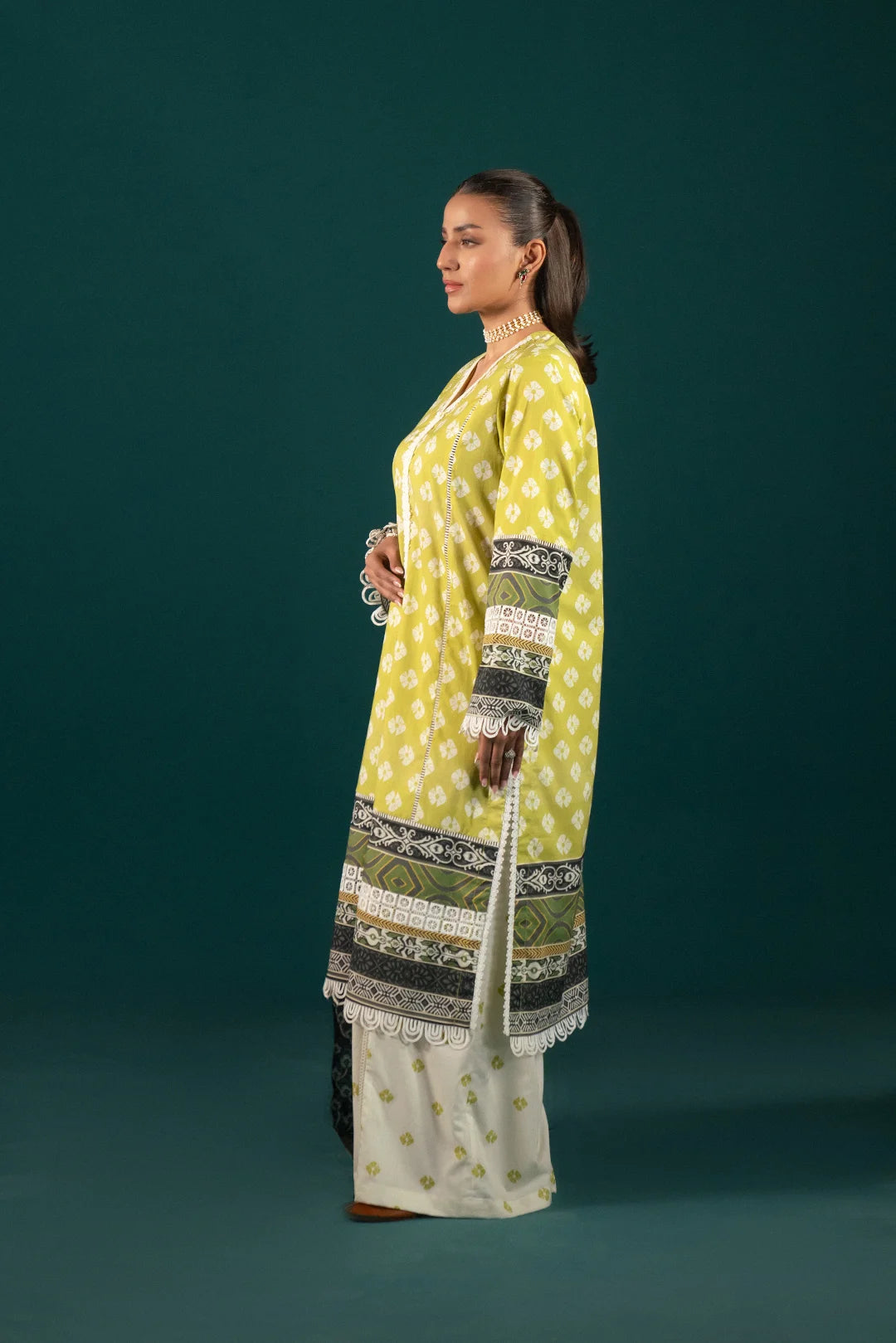 Pakistani Lawn Suits - Summer Collection 2024: A beautiful three-piece lawn dress, perfect for summer fashion, with delicate prints, breathable fabric, and an elegant dupatta to complete the look.