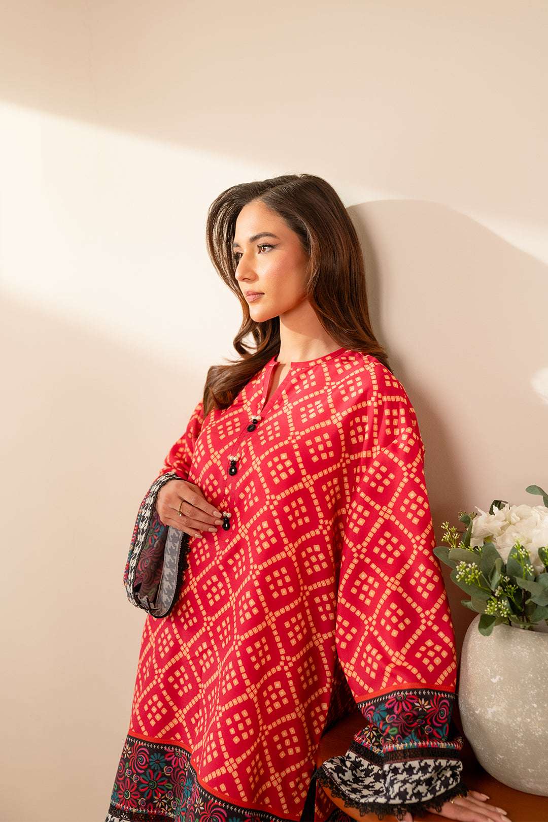 Pakistani casual wear – stylish printed cambric suit in rich red tones with a chic border design.