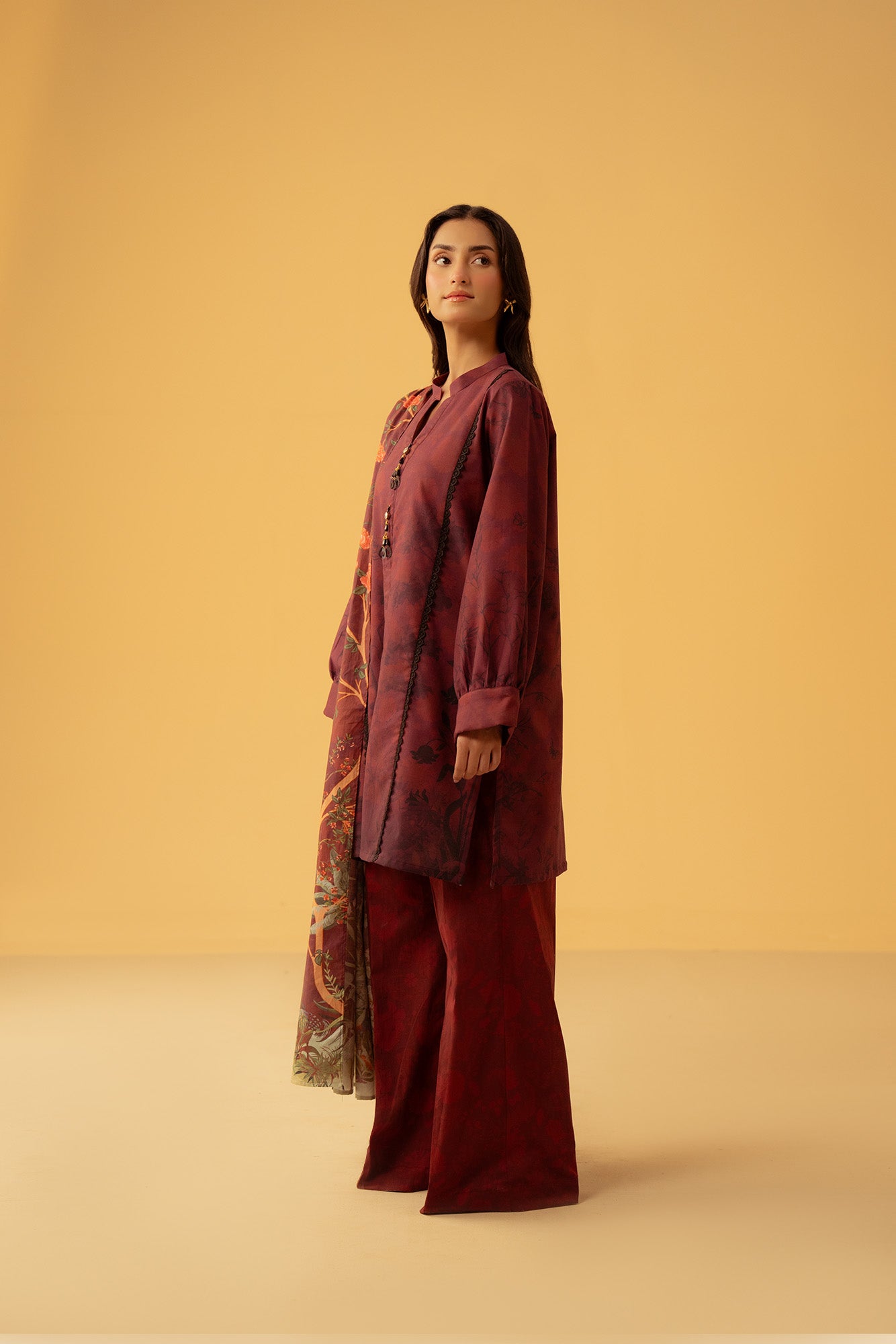 Pakistani unstitched dress material, maroon cambric shirt and dyed trouser with printed silk dupatta, perfect for festive wear in Lahore