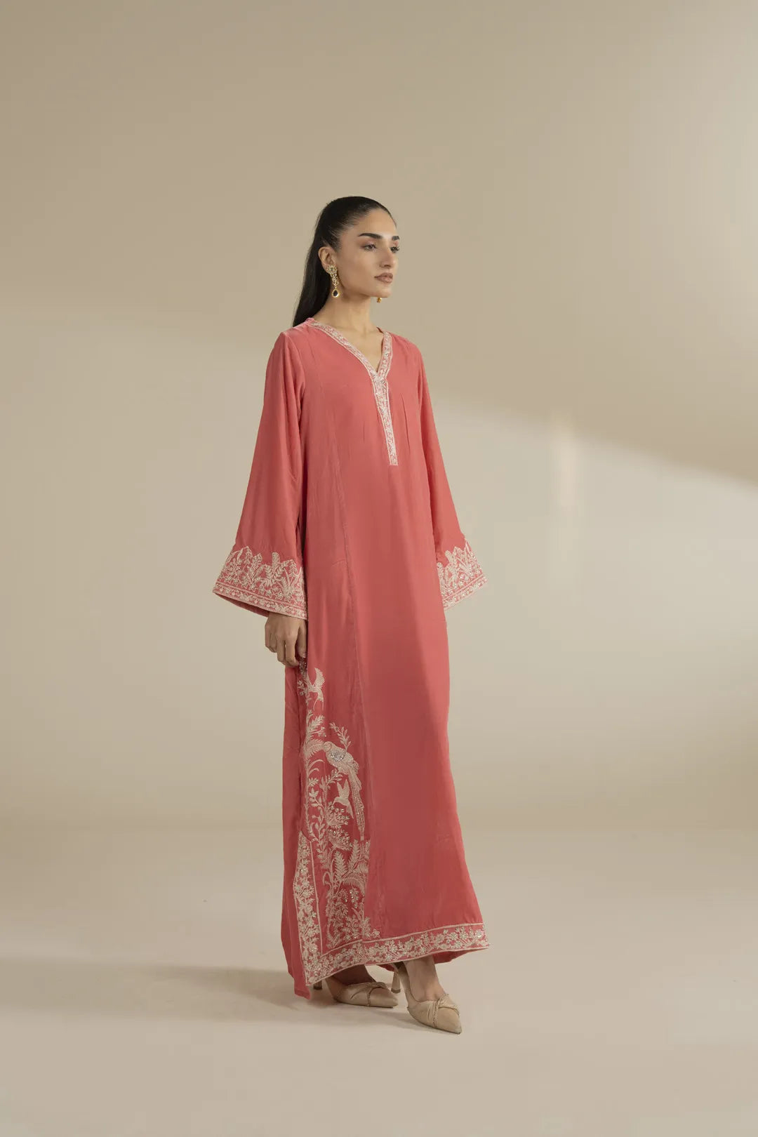 Peach velvet kaftan dress from side angle showing relaxed drape