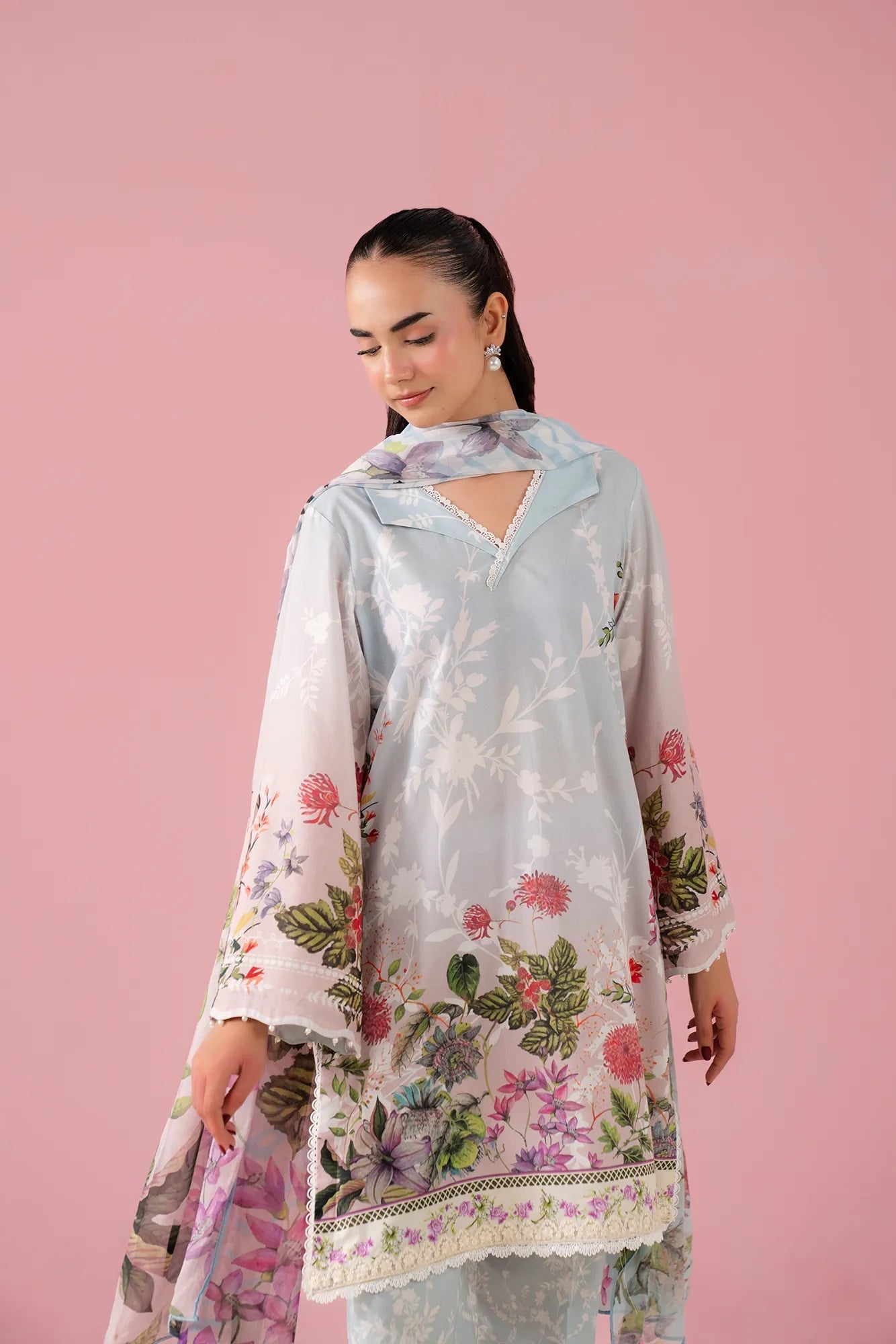 Premium sky pink 3-piece embroidered lawn suit featuring a digital printed shirt, cambric trousers, and chiffon dupatta, designed for women in Sargodha's upscale areas