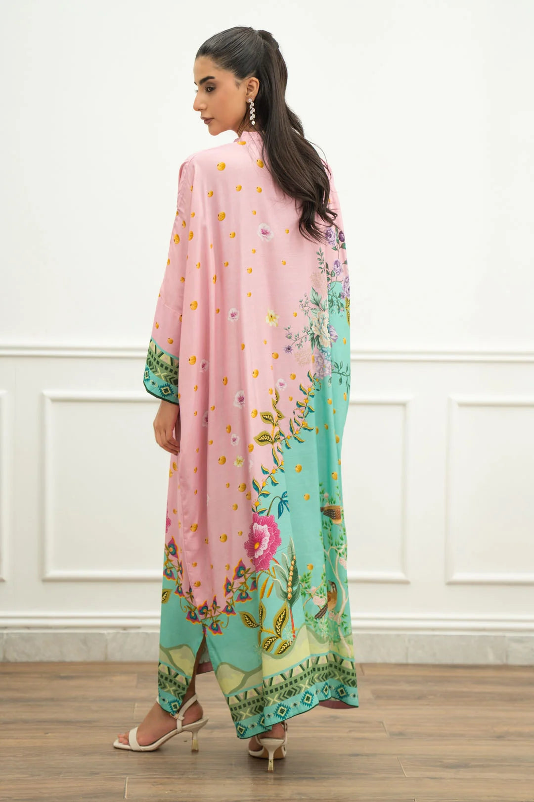 Rear three-quarter view of printed raw silk kaftan with multicolor border
