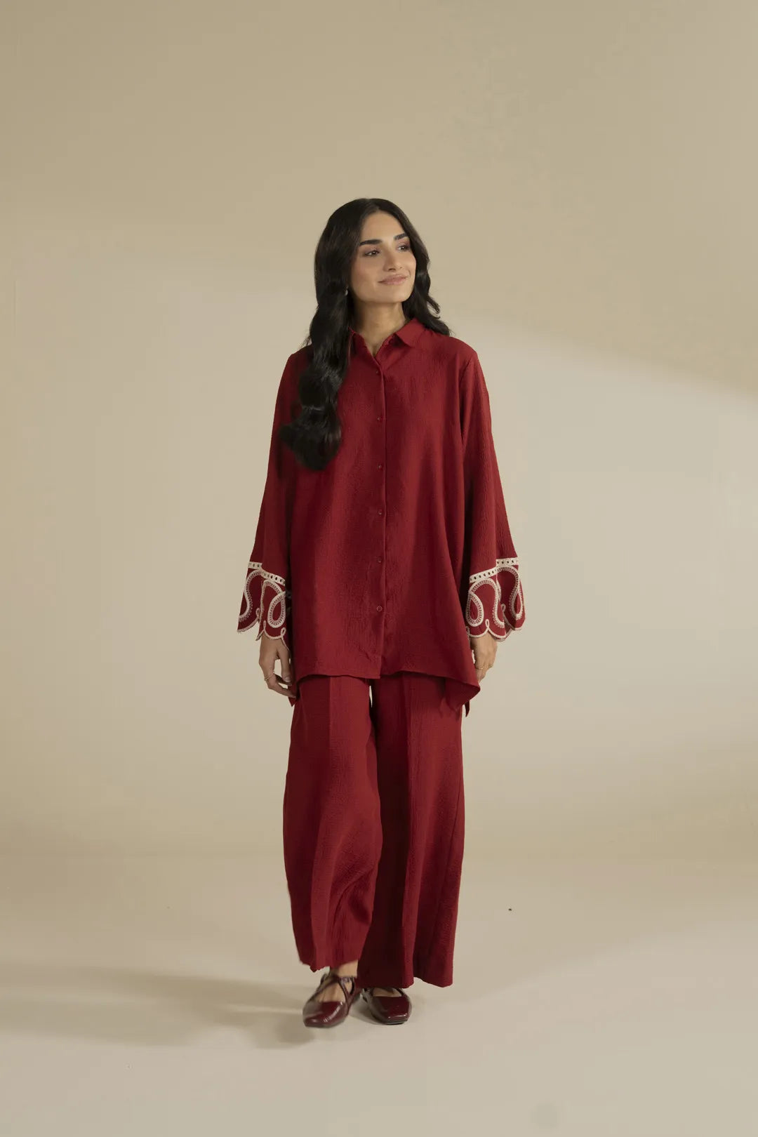 Red 2 piece embroidered suit with white threadwork – full front view