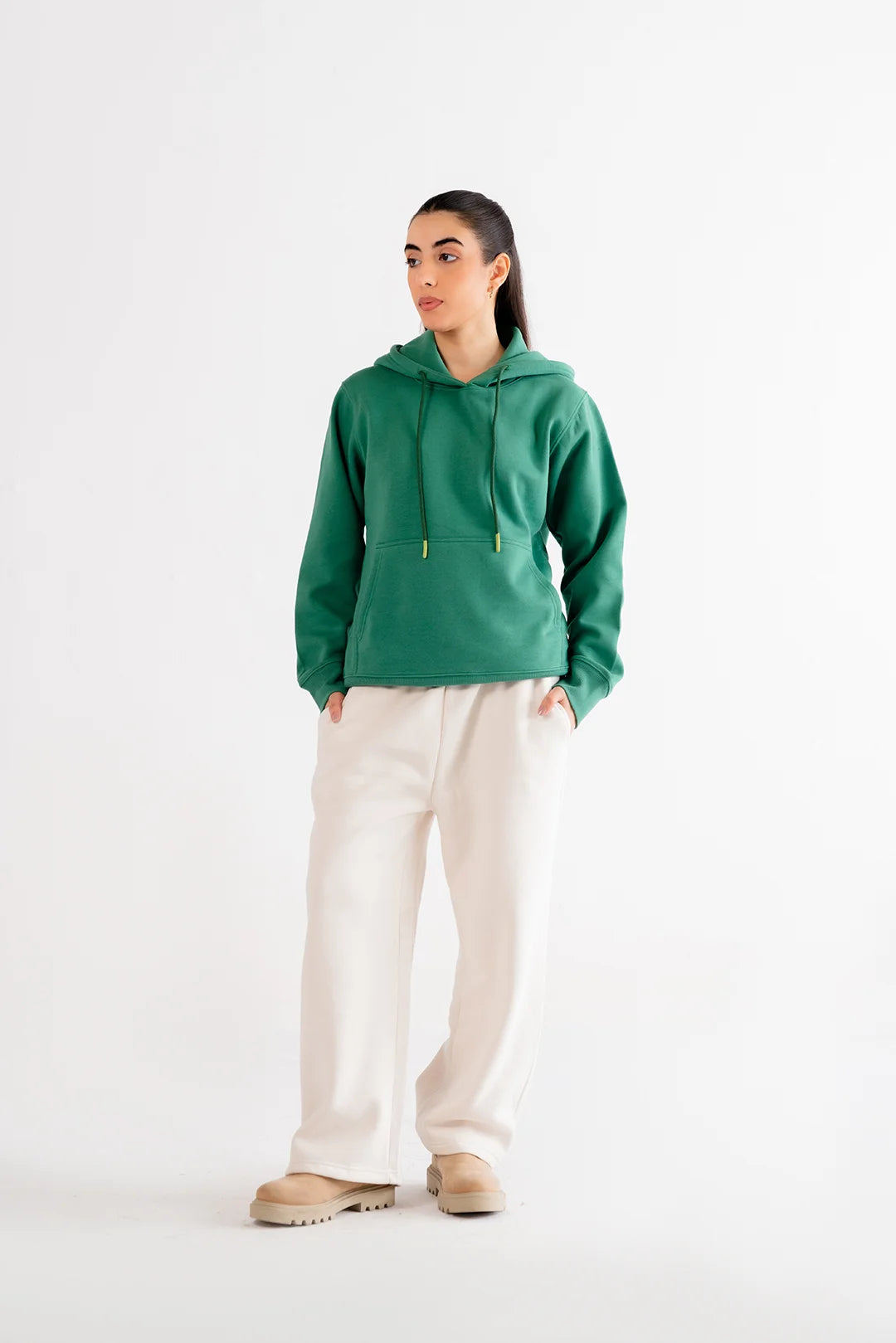 Relaxed-fit green hoodie, combining functionality and style with a comfortable and timeless design.