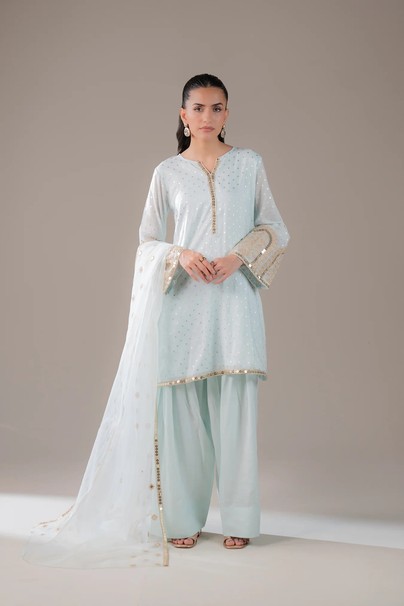 Shop light blue 3 piece jamawar suit for women – embroidered formal Pakistani dress with organza dupatta and golden detailing, ideal for weddings and festive wear.