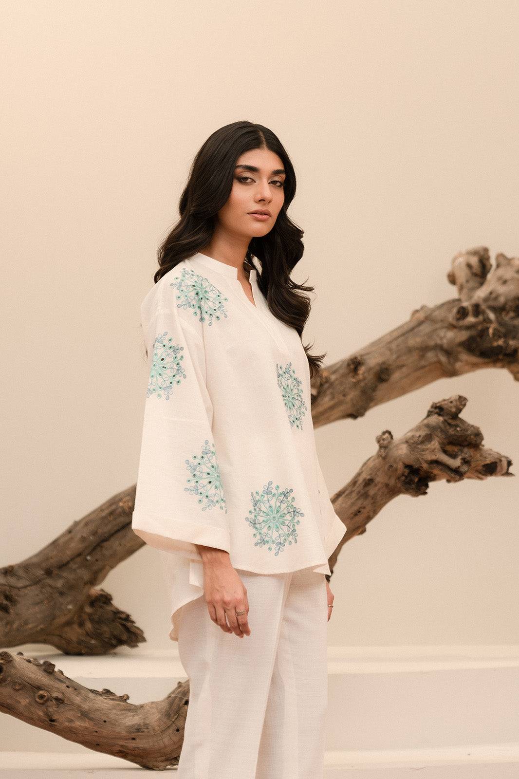 Shop online 1-piece embroidered khaddar shirt in off-white for a classic winter look