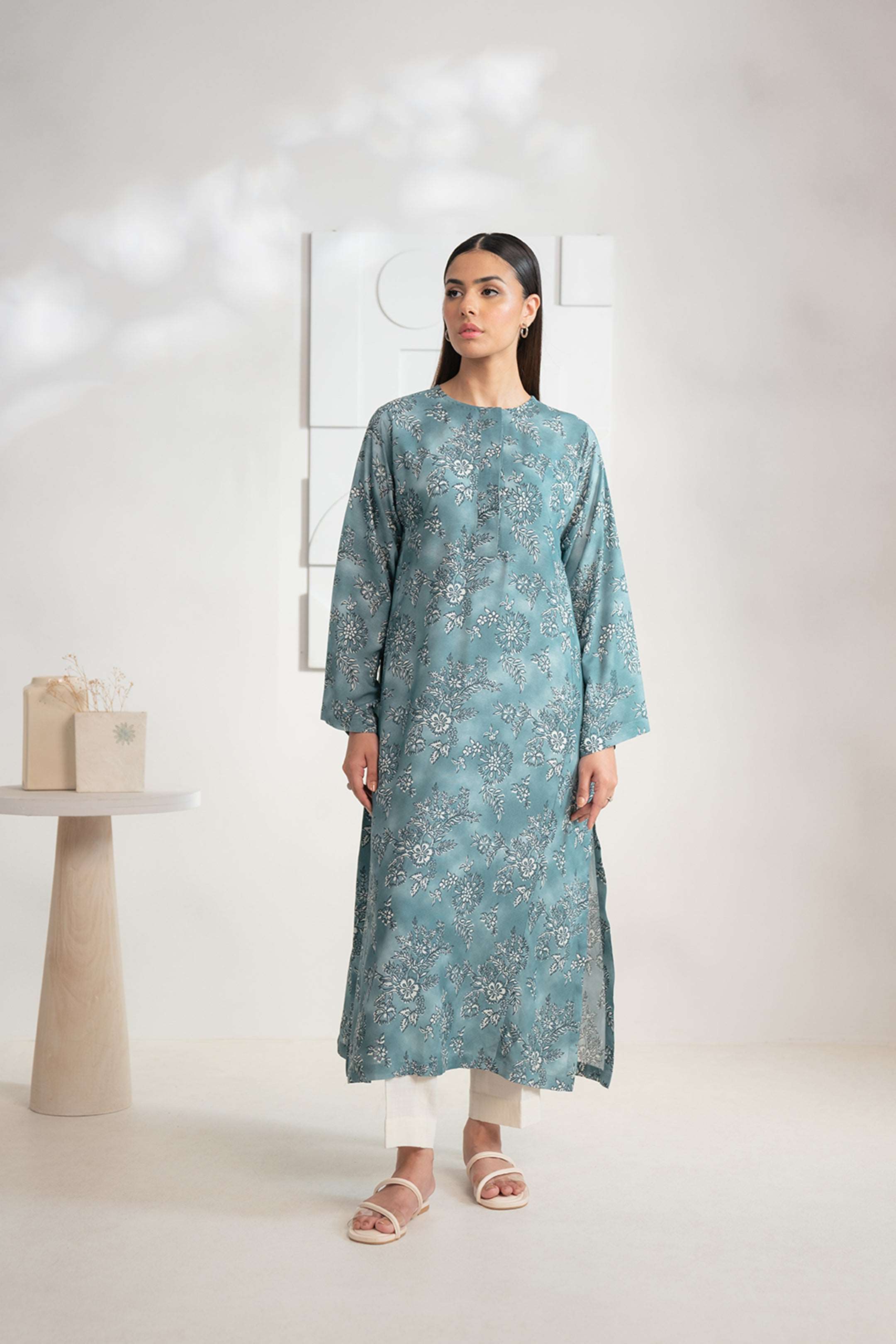 Shop this elegant teal floral printed Karandi shirt for women online, perfect for a fine day outfit