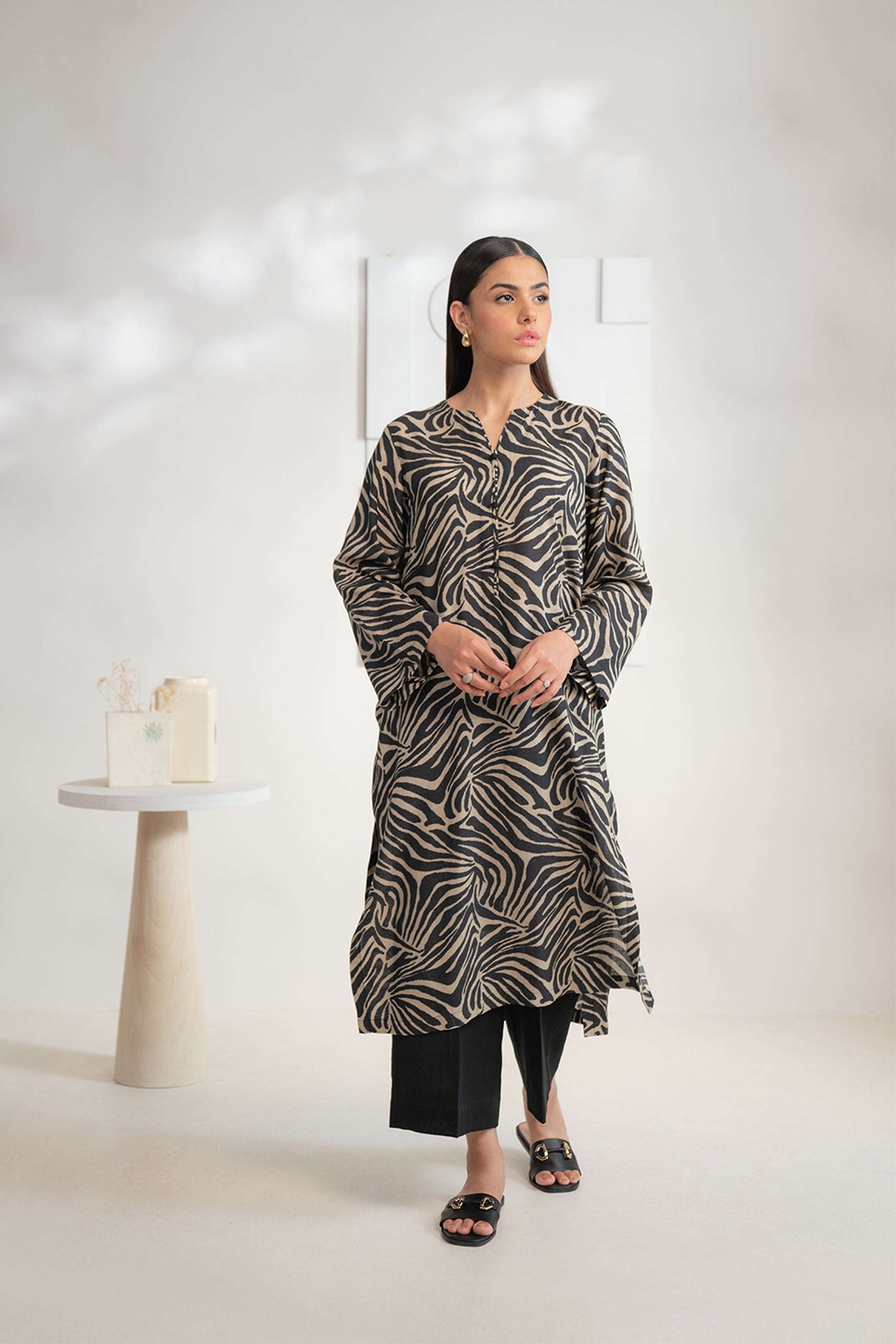 Shop women’s printed Karandi shirt with bold zebra pattern, a versatile outfit online