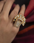 Side angle of kundan ring showing raised setting and bold shine on finger.