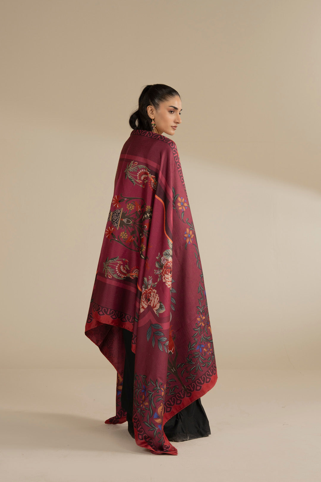 Side/back view of maroon printed shawl showing length, drape, and floral pattern coverage.