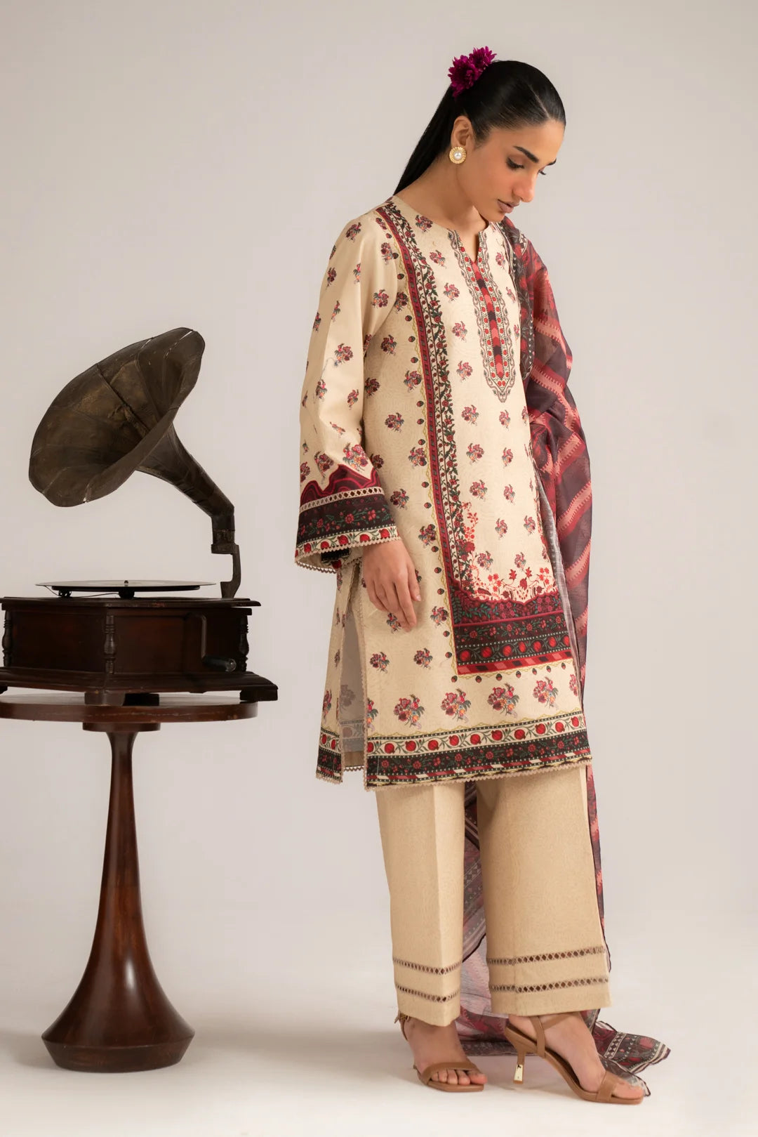 Side full-length view of ivory printed lawn suit with cambric trousers