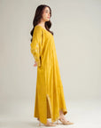 Side profile of full-length mustard embroidered kaftan for women