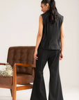 Side view of black solid co-ord set with cropped vest and flowy wide-leg pants
