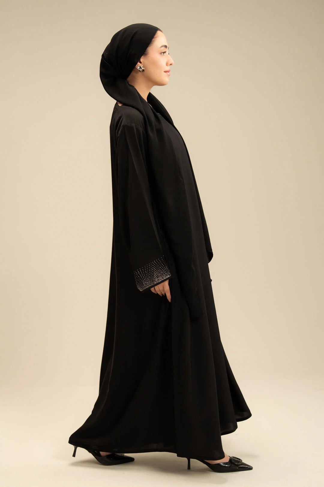 Side view of black stone sleeve abaya – graceful silhouette modest wear Beyond East