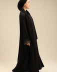 Side view of black stone sleeve abaya – graceful silhouette modest wear Beyond East