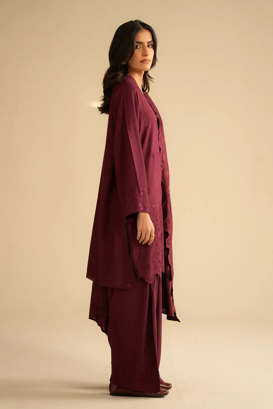 Side view of maroon 3-piece linen suit showing straight trousers and flowing dupatta length.