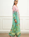 Side view of pink and mint printed kaftan in a full-length silhouette
