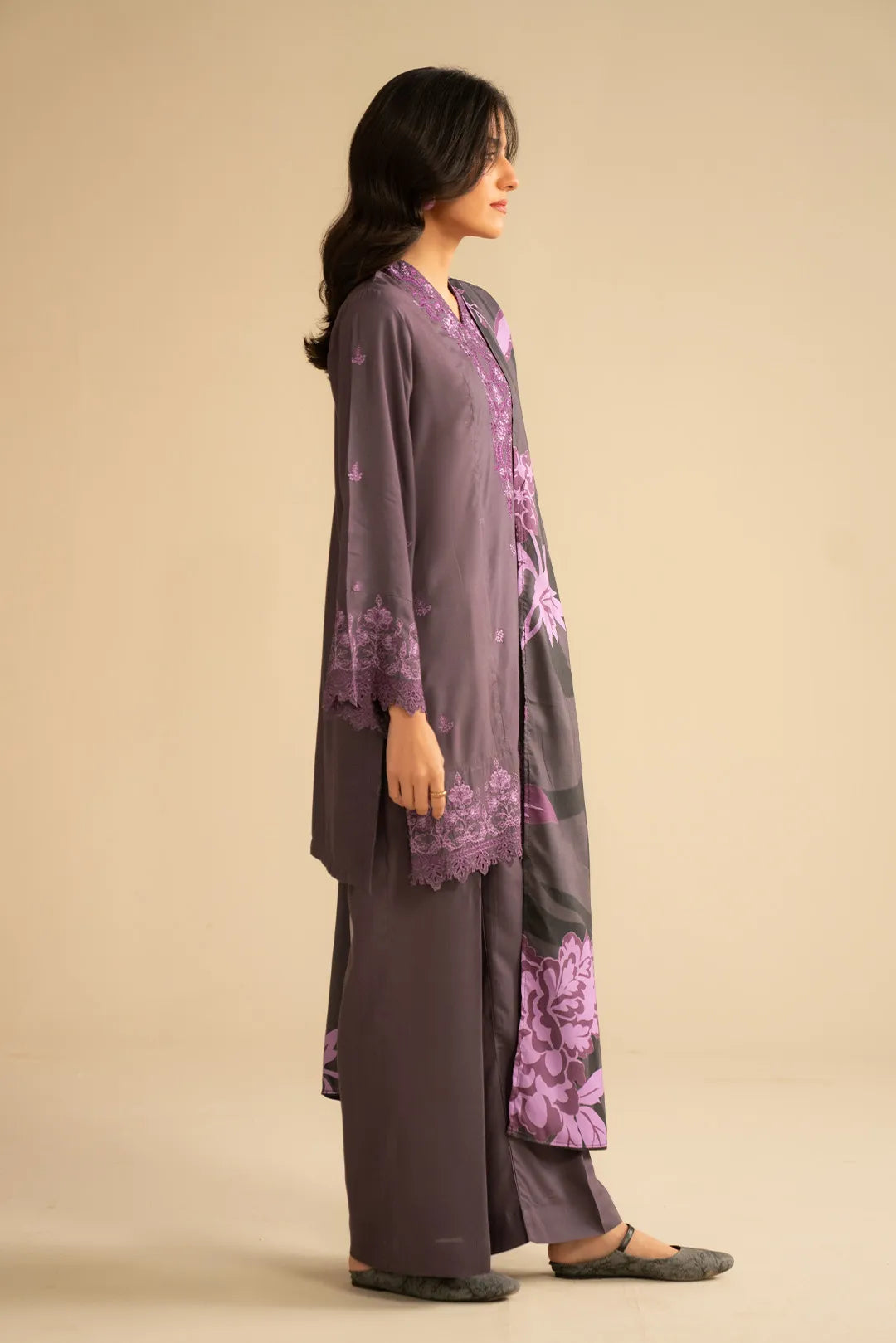 Side view of purple linen suit showing straight-fit trousers and relaxed kurta shape