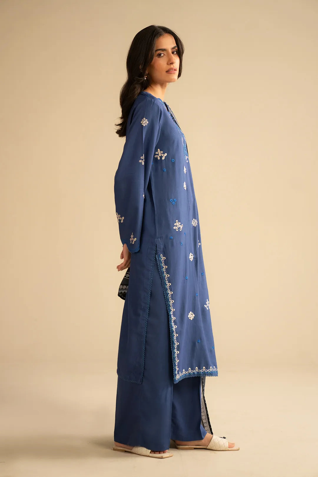 Side view of royal blue linen suit with straight silhouette and matching trousers