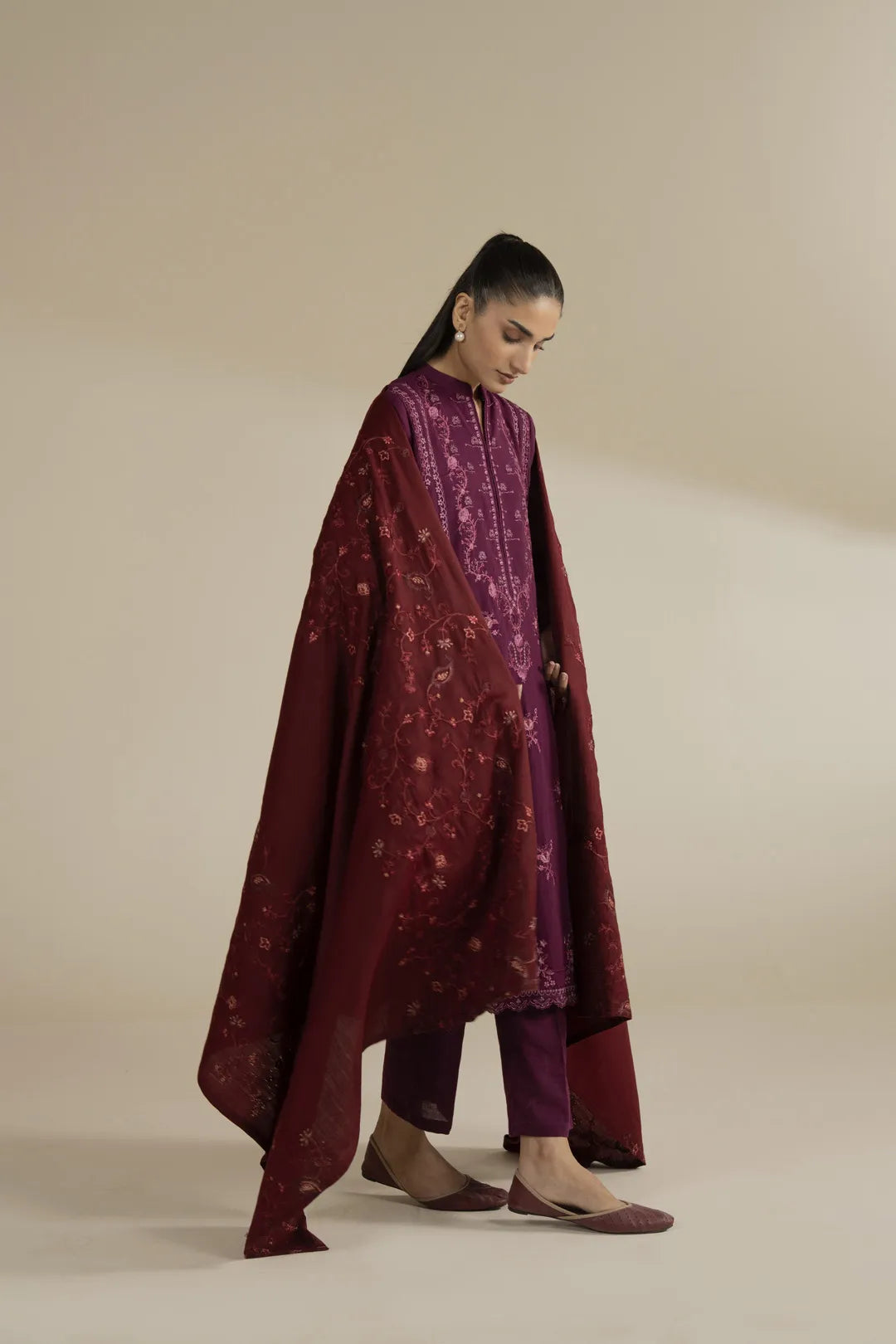 Side view showing maroon embroidered shawl fall and length