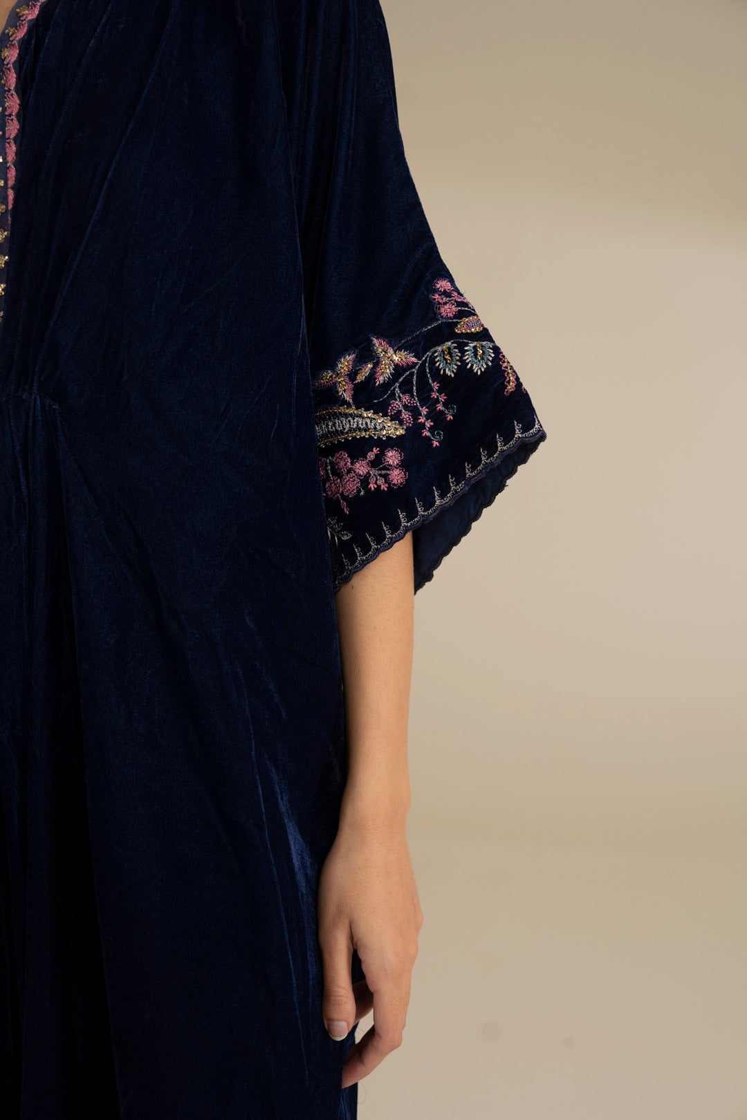 Sleeve border detail on the velvet kaftan, showing embroidery placement and finishing.