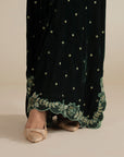 Sleeve detail on the velvet kaftan showing embroidered finishing and relaxed cut.