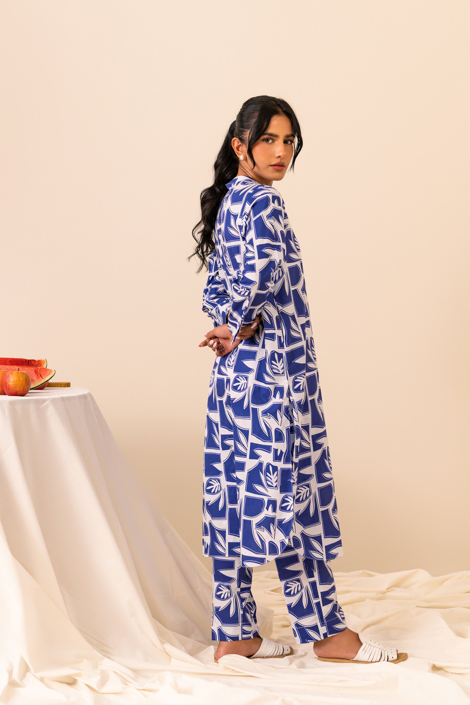 Stand out in a striking blue and white printed cambric shirt and trouser set