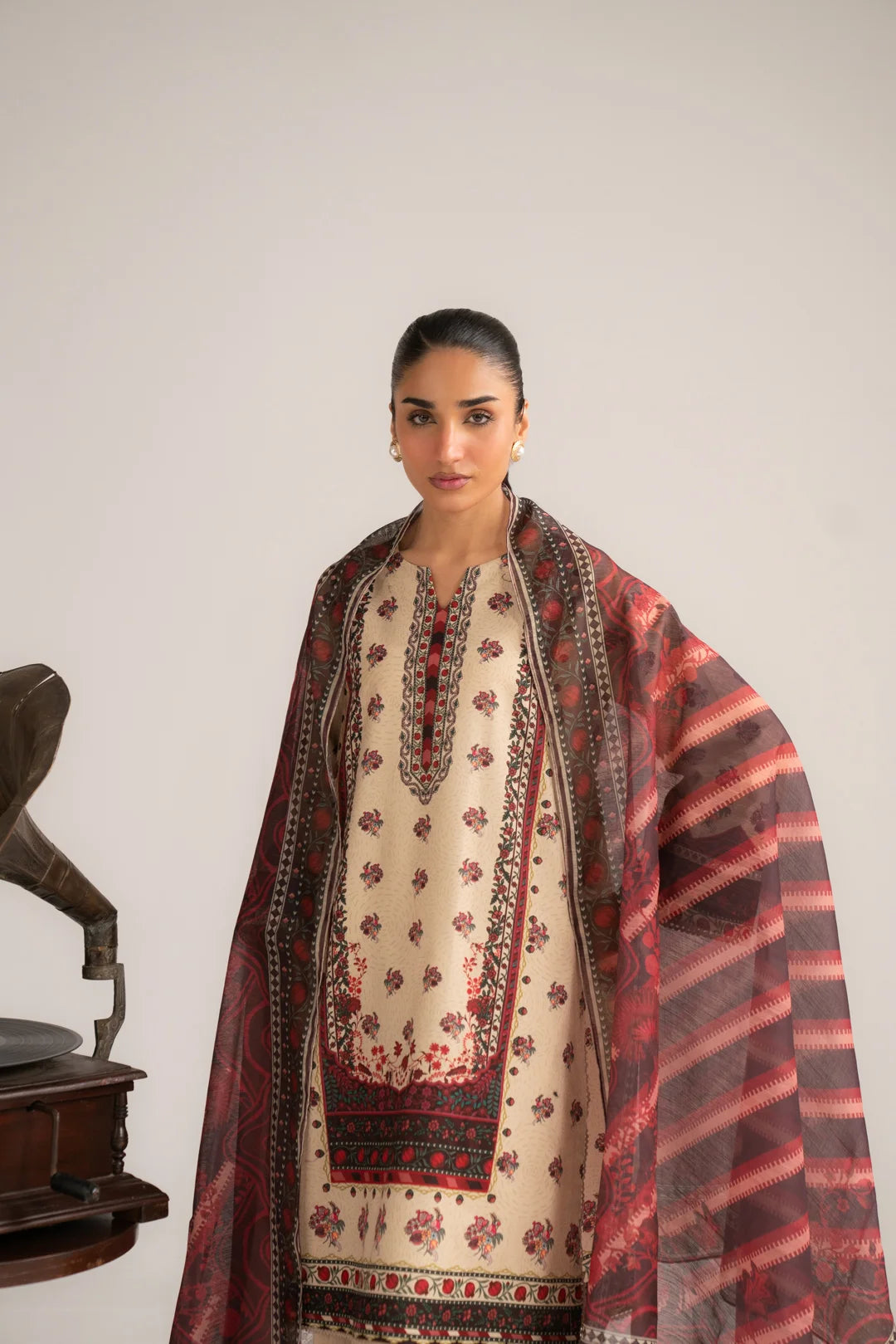 Straight front pose of light brown and ivory unstitched lawn suit for women