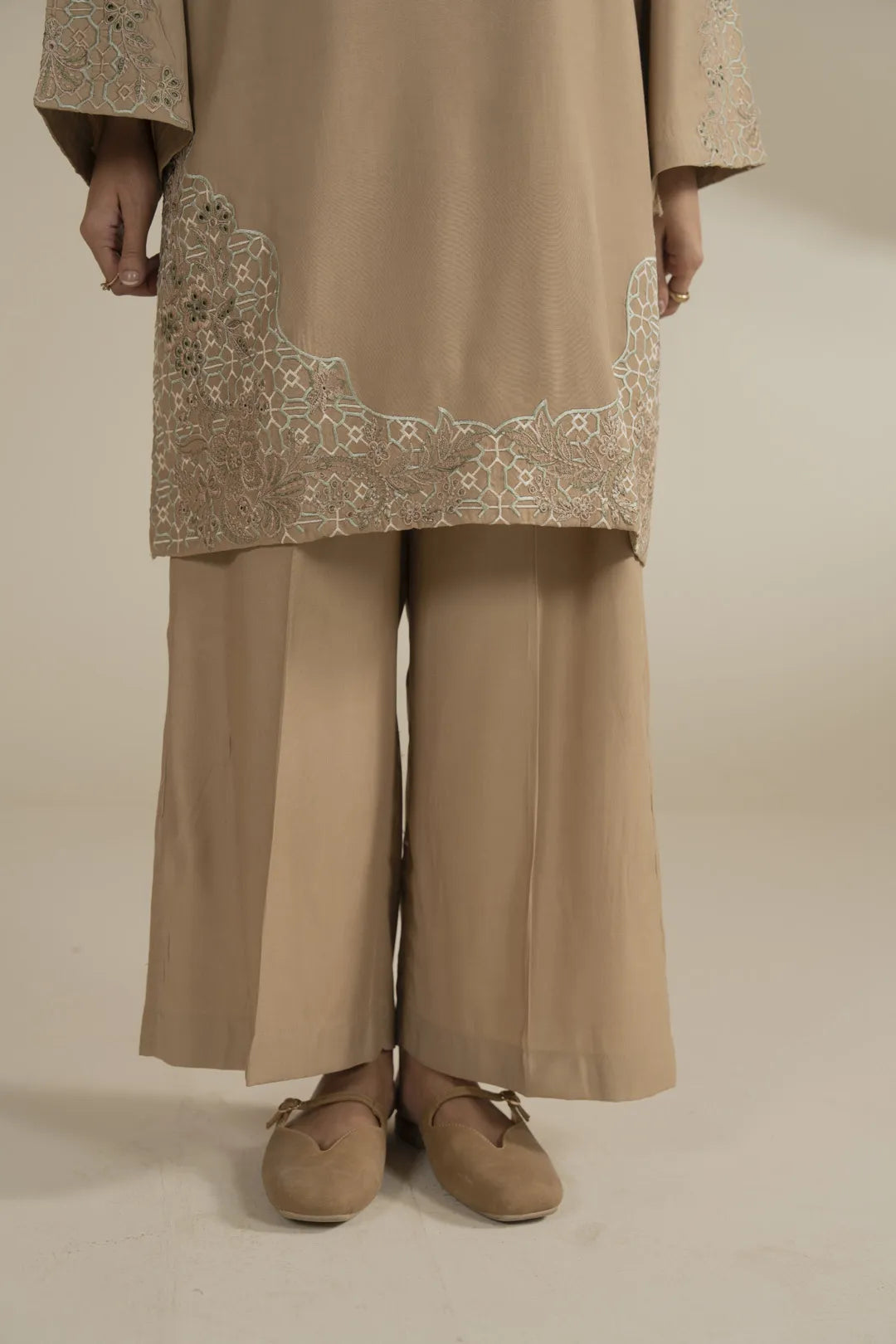 Studio styling of neutral beige 2 piece embroidered suit for everyday and smart casual wear.
