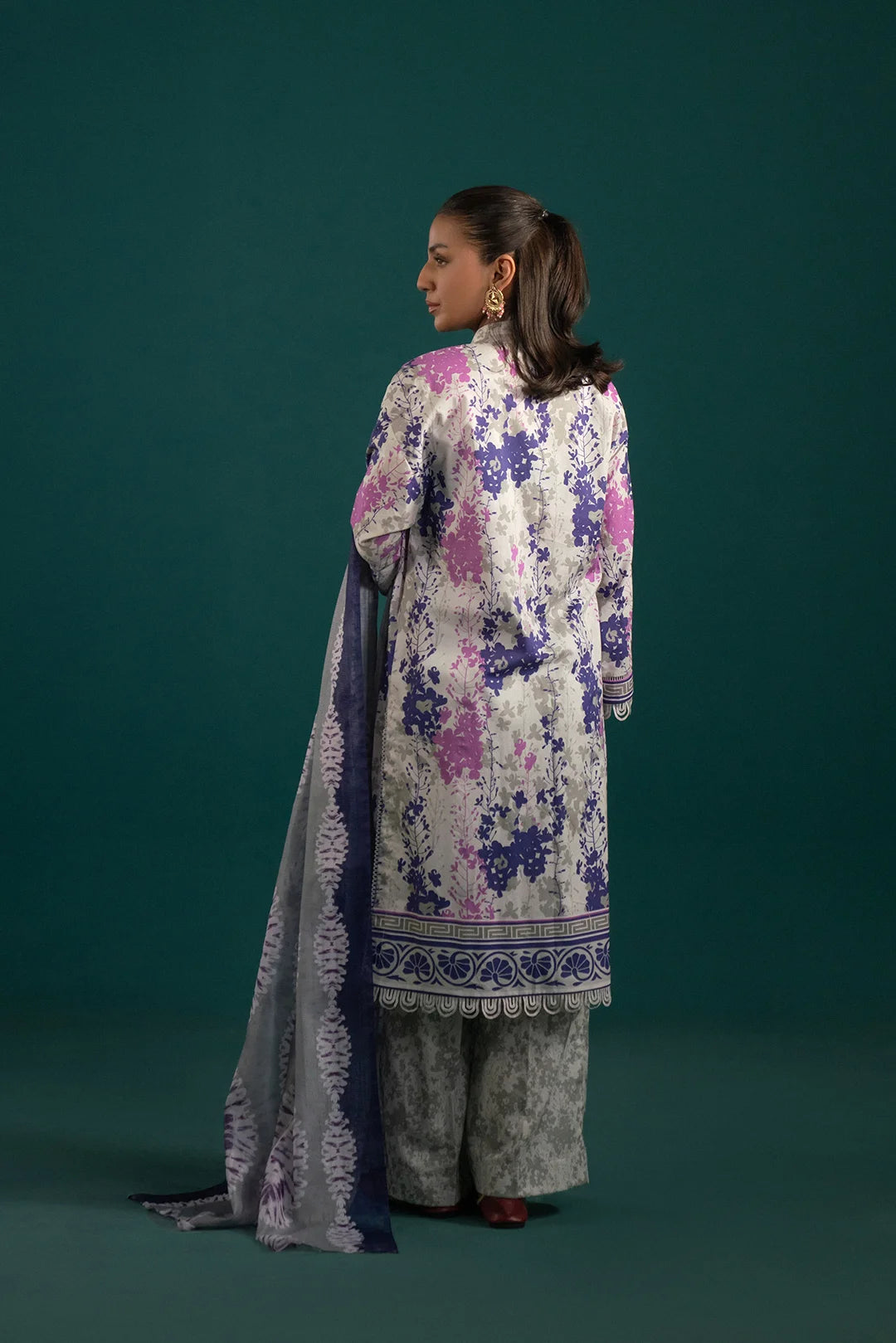 Stylish Pakistani lawn suits featuring a soft grey floral printed shirt with a purple and lilac monark dupatta for a sophisticated look.
