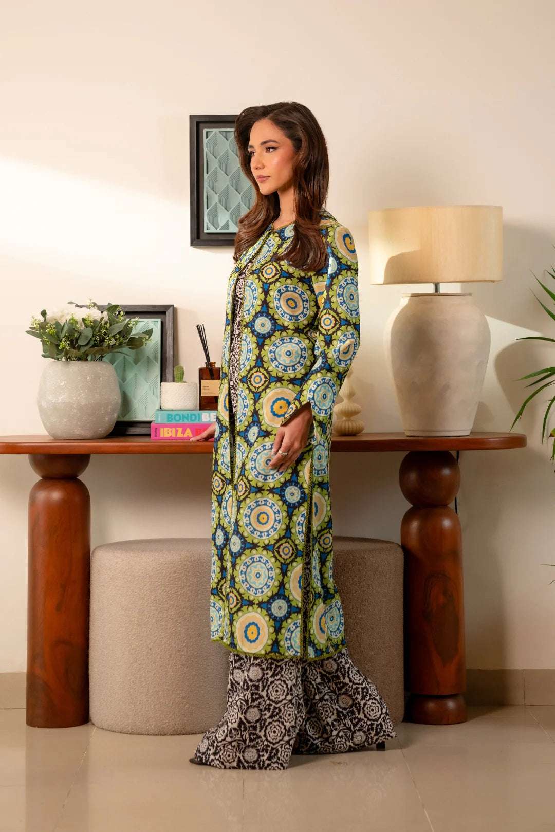 Stylish cambric summer suit – vibrant green and blue printed kurta with trendy black patterned trousers.