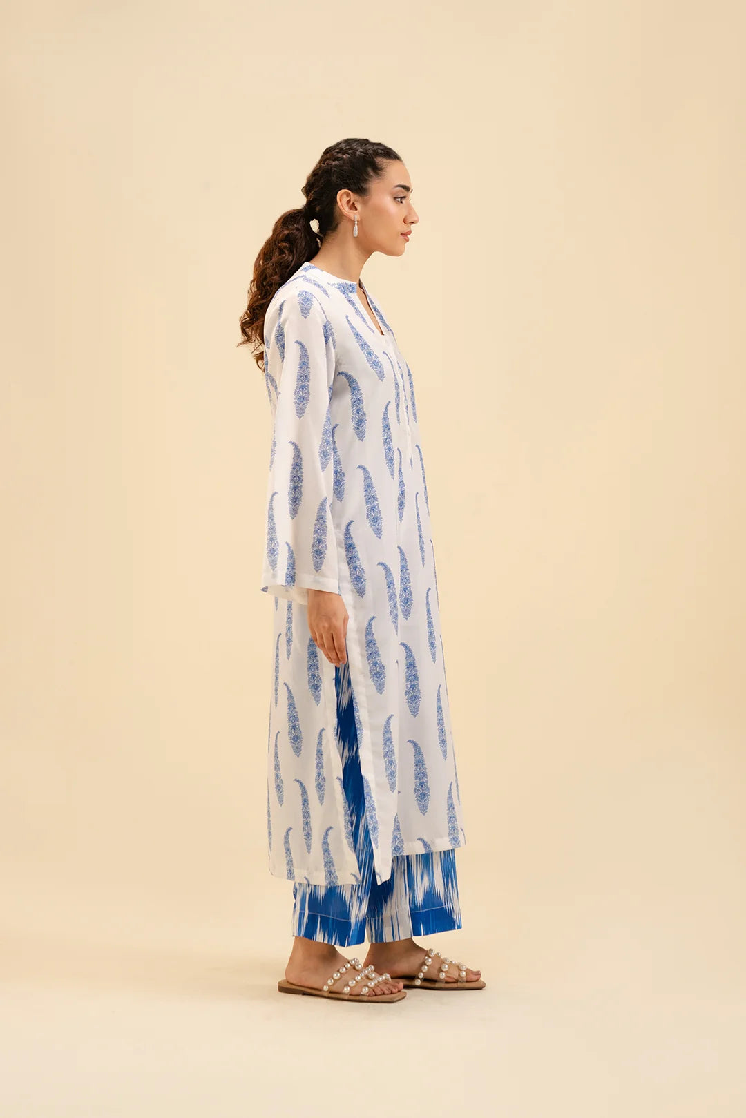 Stylish white and blue printed shirt with ikat pants – trendy summer wear.