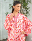 Three-quarter view of women’s pink printed kaftan with loose sleeves