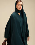 Three quarter view emerald abaya – dark green modest wear abaya Beyond East