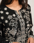 Timeless black dobby outfit featuring exquisite embroidery on front and sleeves