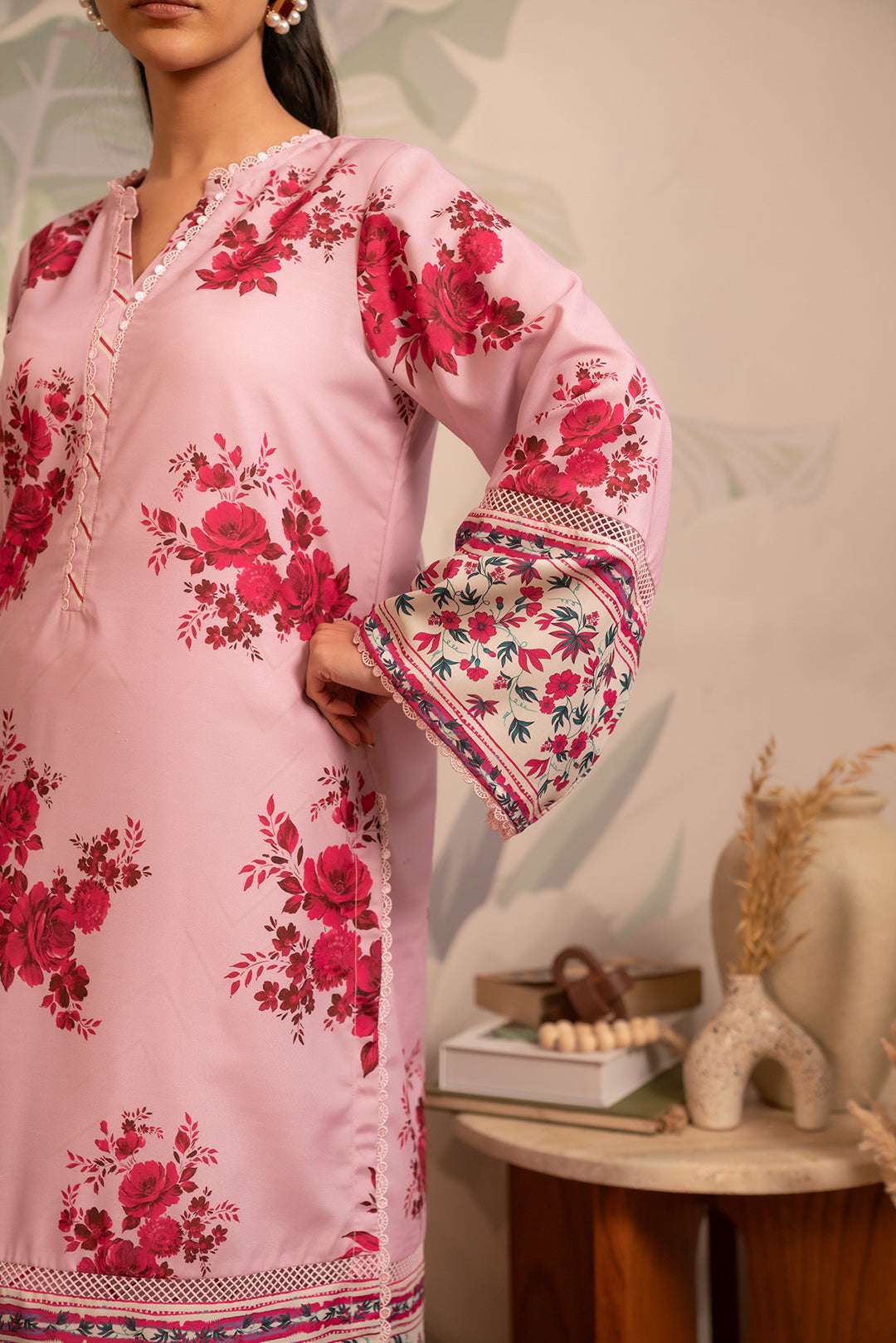 Trendy Pakistani unstitched cambric suit – soft pink base with digital floral and zigzag prints for a chic look.