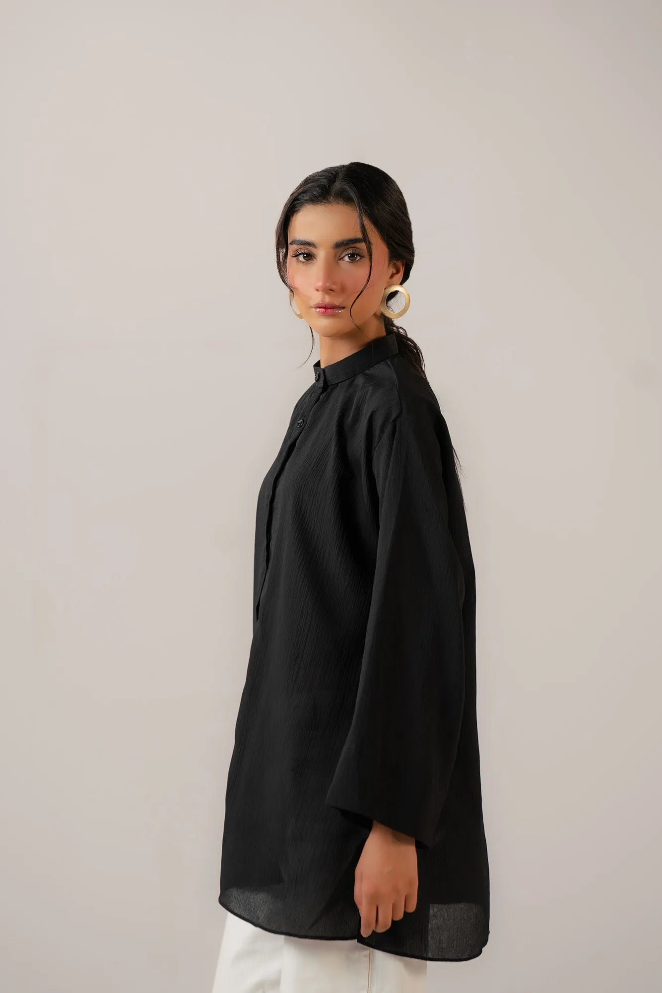 Trendy long sleeve black shirt for women in modern minimalist style