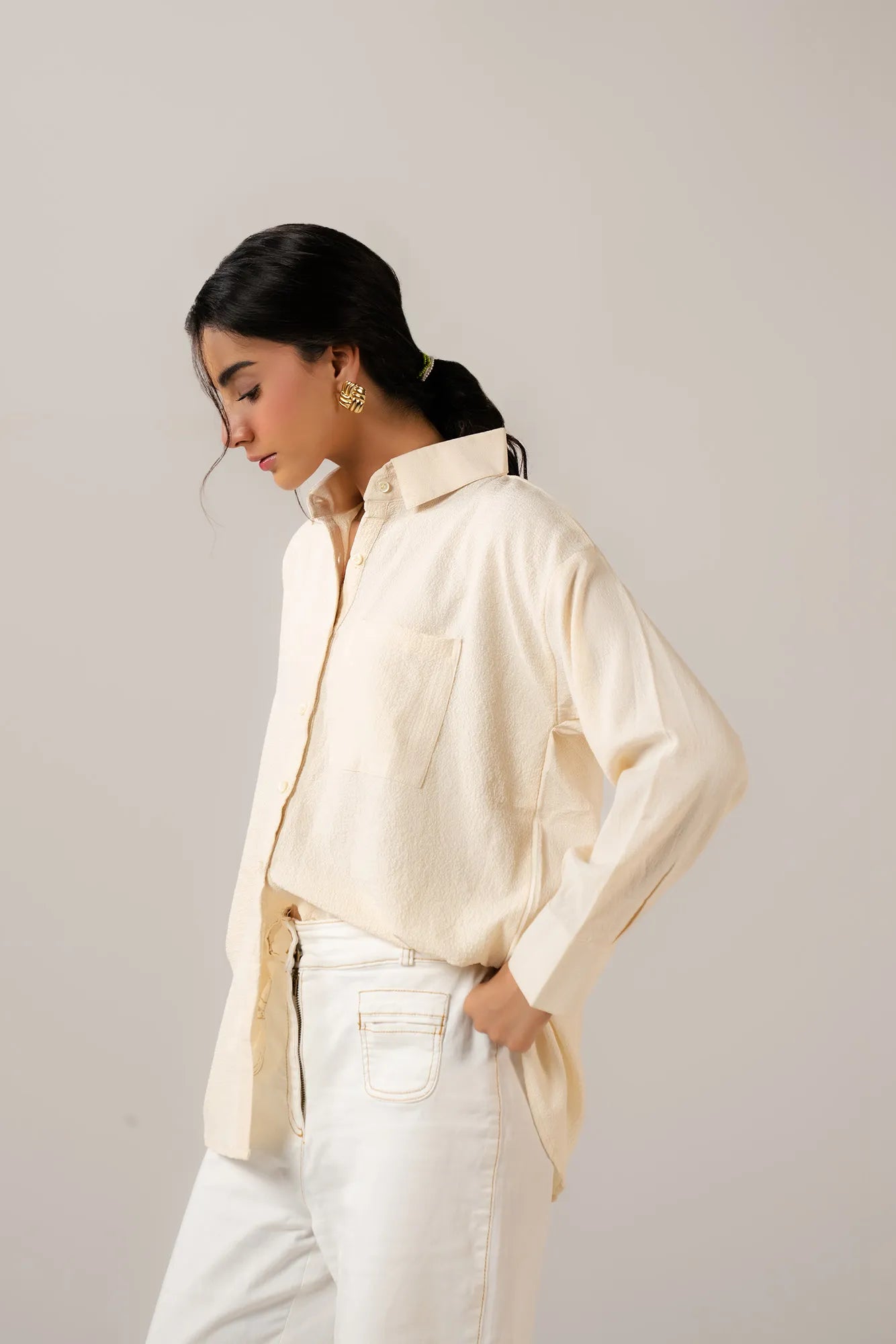 Trendy oversized button-down women western shirt paired with white jeans
