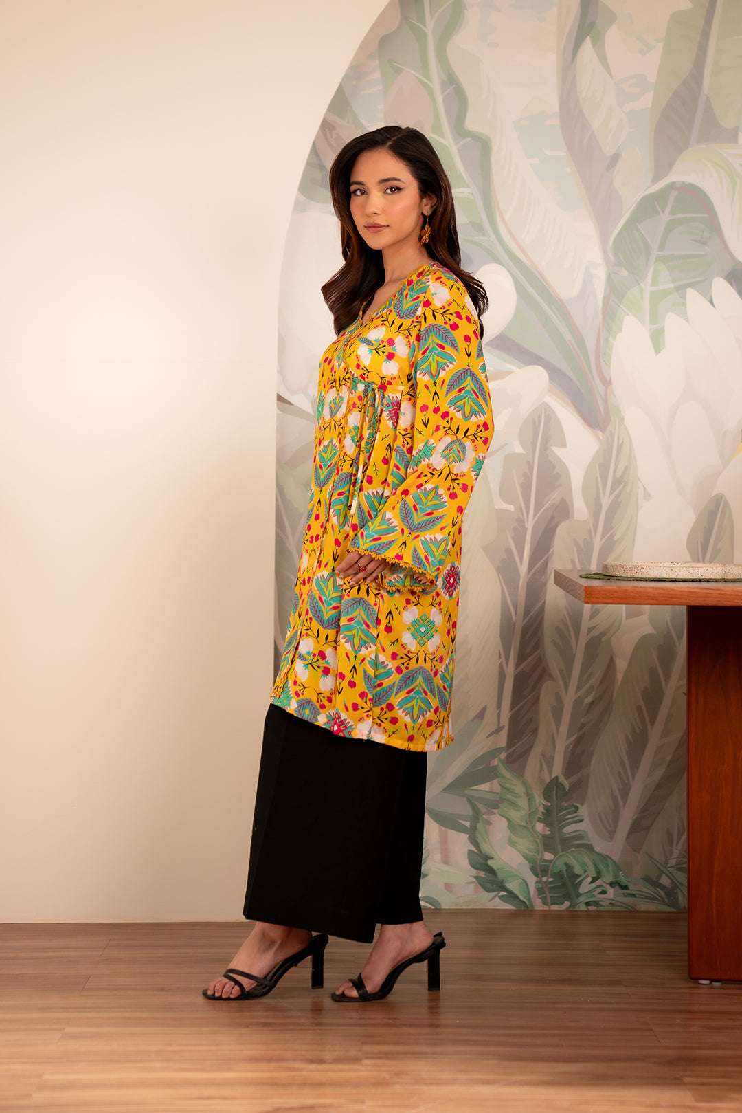 Trendy winter linen kurta for ladies – bold multicolor design on bright yellow base for a lively look.