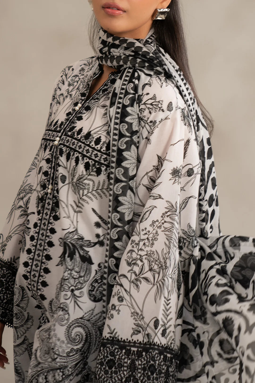 Unstitched 2 piece lawn suit featuring floral motifs and chiffon dupatta