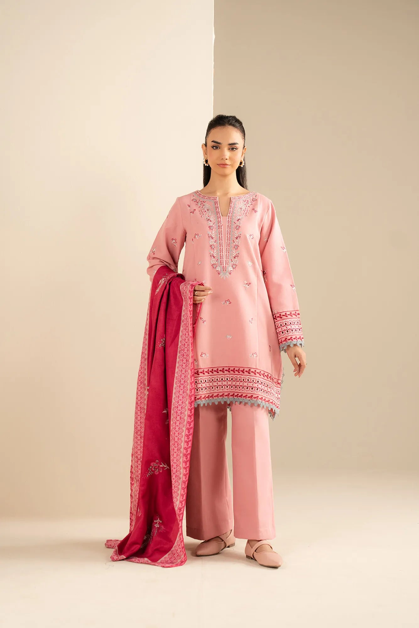 Unstitched khaddar suit in pastel pink with matching trouser and printed shawl drape