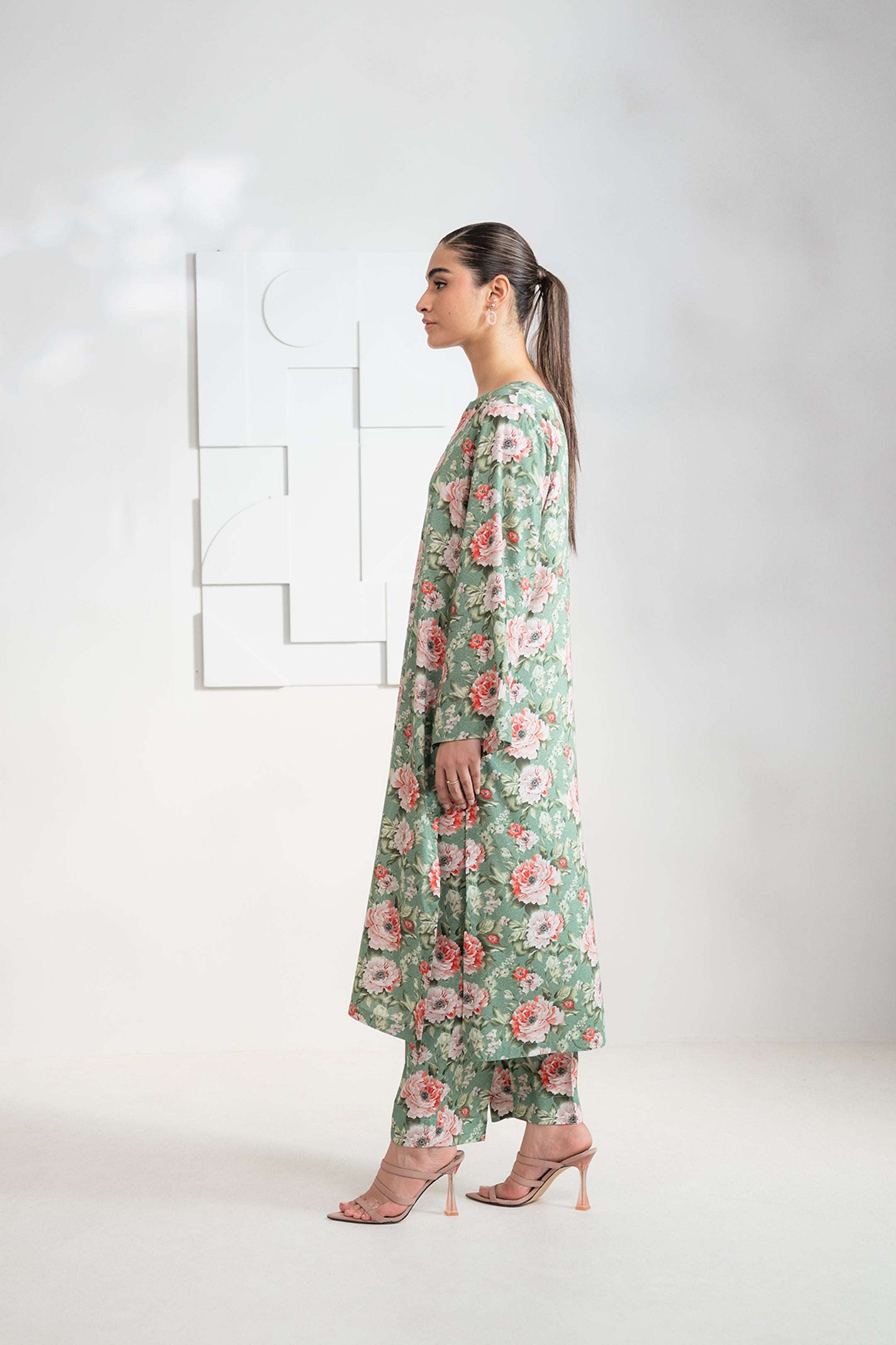 Upgrade your wardrobe with a green 2-piece printed linen suit, available for purchase online