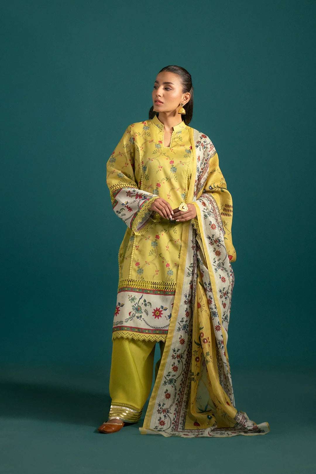 Vibrant Yellow 3 Piece Lawn Suit with Monark Dupatta: This beautifully printed lawn suit features a striking yellow shirt, dyed cambric trousers, and a floral monark dupatta for a refined look.