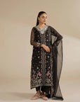 Wedding-ready black organza suit styled with sheer dupatta, showing elegant overall drape.