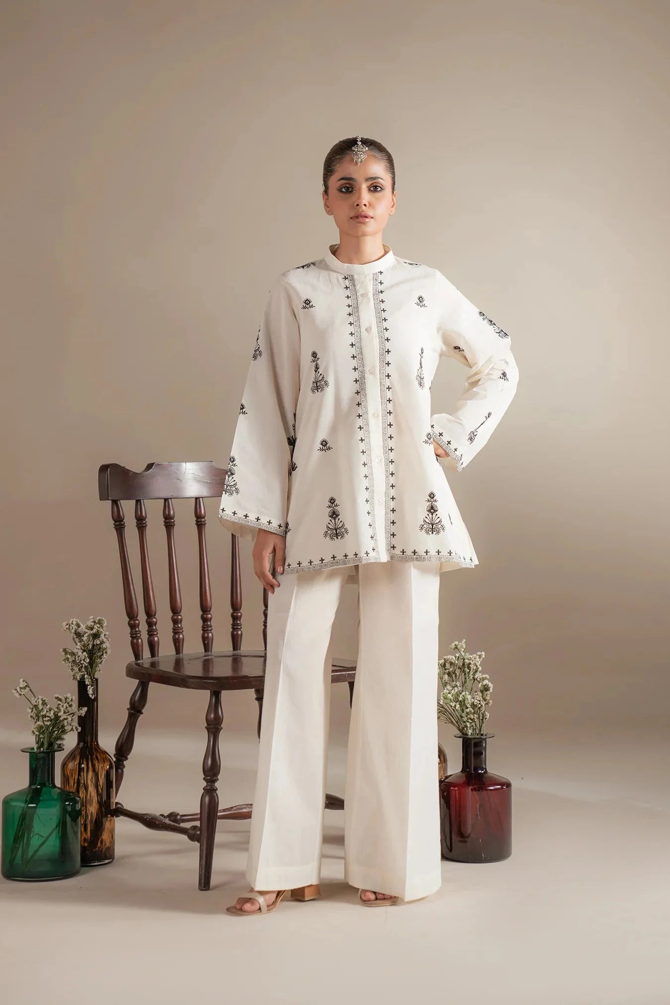 Where to buy elegant white monochrome outfits with black embroidery for Muharram