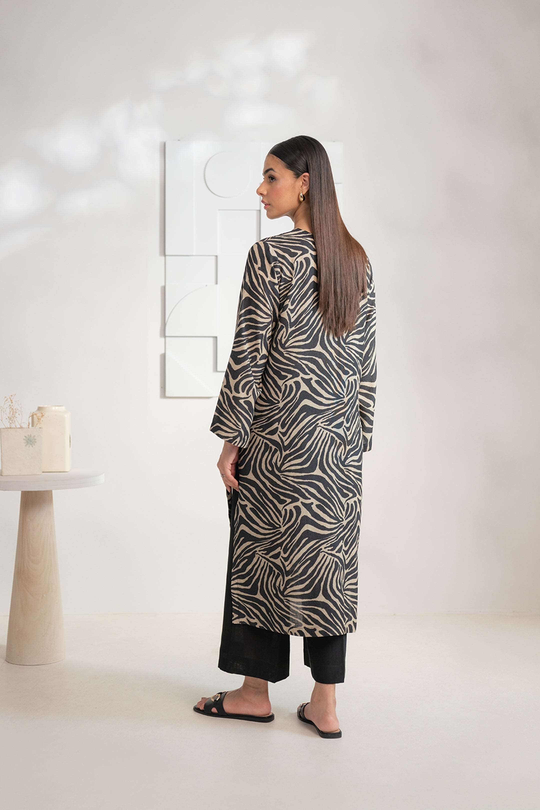 Women’s black Karandi shirt featuring a bold zebra print, shop this contemporary piece online